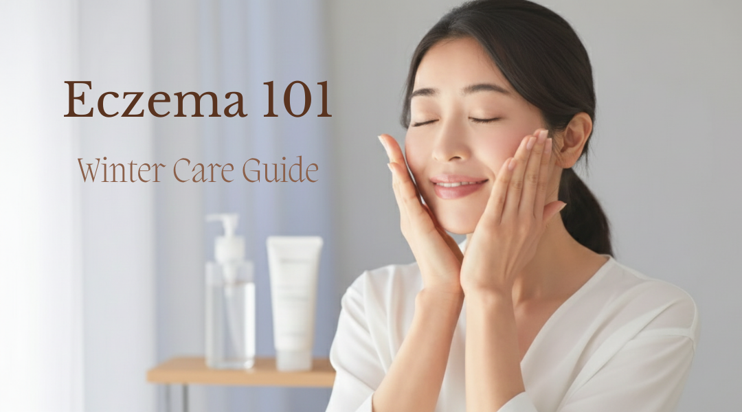 A woman gently touching her face in a bright, minimal bathroom setting, illustrating a calm winter skincare routine for eczema and sensitive skin.