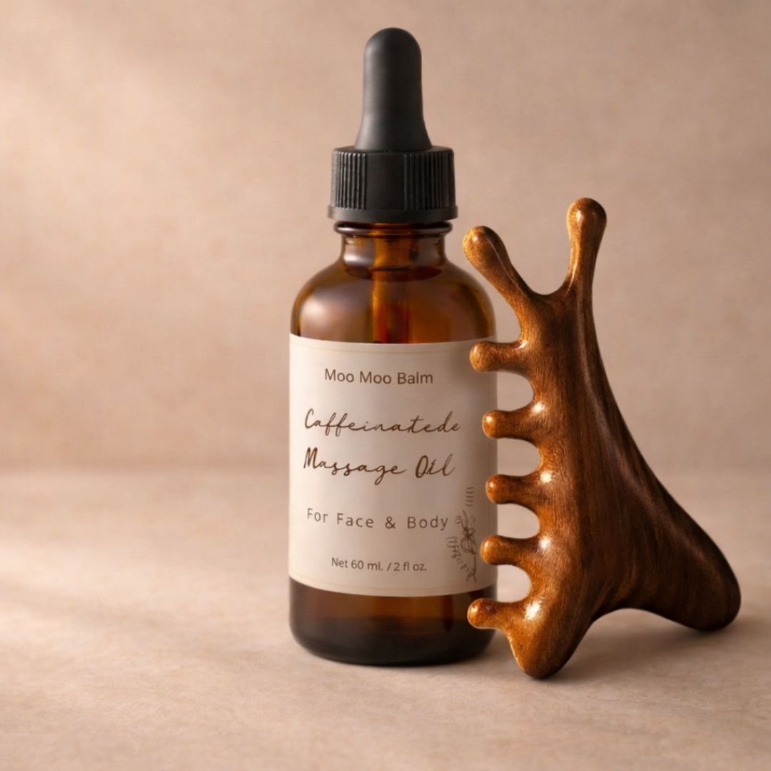 caffeinated massage oil with wooden gua sha tool for facial massage and depuffing