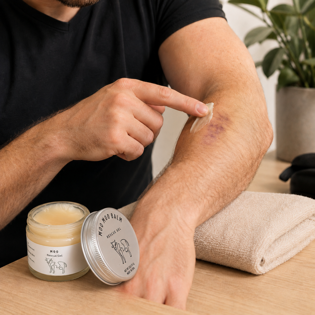 Man applying Moo Moo Rescue Gel to a minor bruise on his arm. Nourishing tallow and calendula balm for everyday skin discomfort and recovery support.